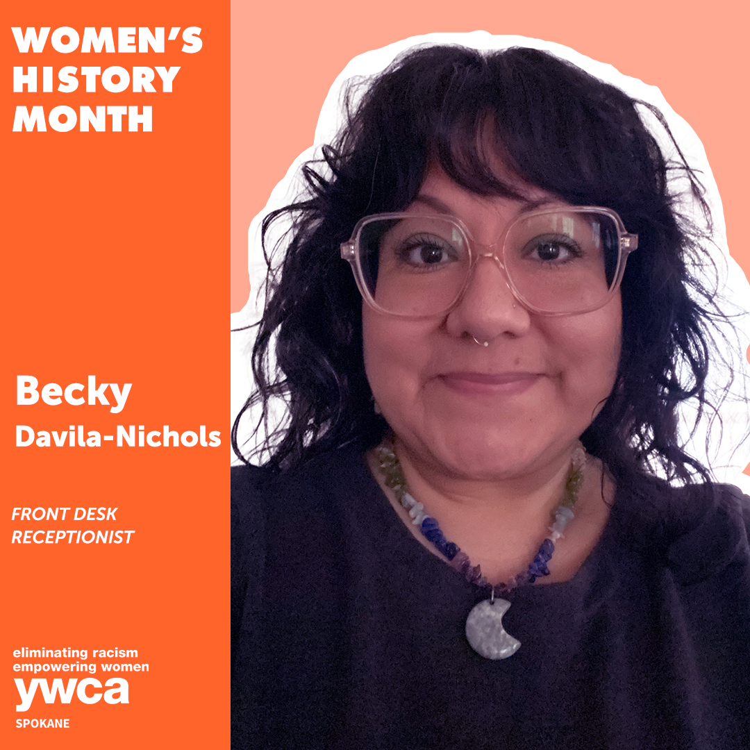 Image of a smiling woman with brown hair and brown eyes wearing glasses and a half moon beaded necklace with text that says, "Woman's History Month, Becky Davila-Nichols, front desk receptionist"