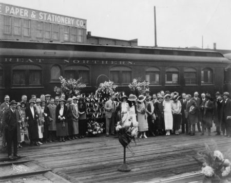 A group of YWCA Spokane members gathered in front of a train, circa 1924