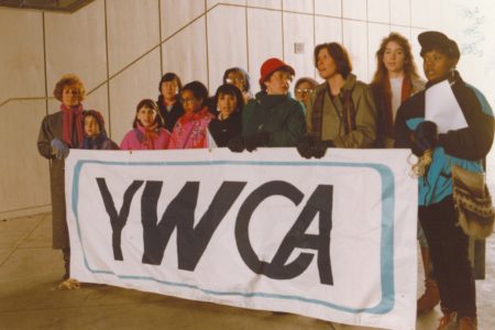 A group gathered in Spokane holding a YWCA sign